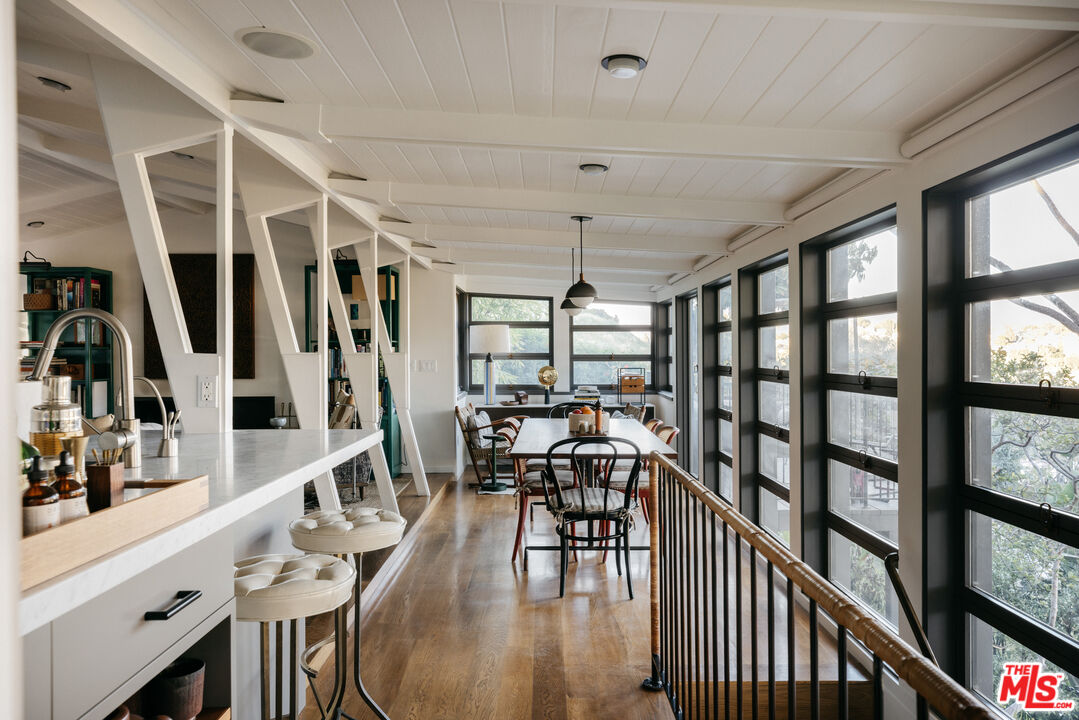 2044 Mayview Drive Los Angeles, CA 90027 - Photo 14 of 44 a view of a dining room with furniture window and wooden floor