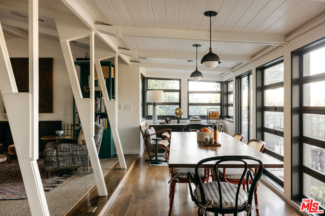2044 Mayview Drive Los Angeles, CA 90027 - Photo 15 of 44 a view of a dining room with furniture window and wooden floor