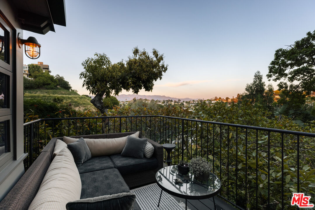 2044 Mayview Drive Los Angeles, CA 90027 - Photo 18 of 44 a view of a roof deck with couches and sky view