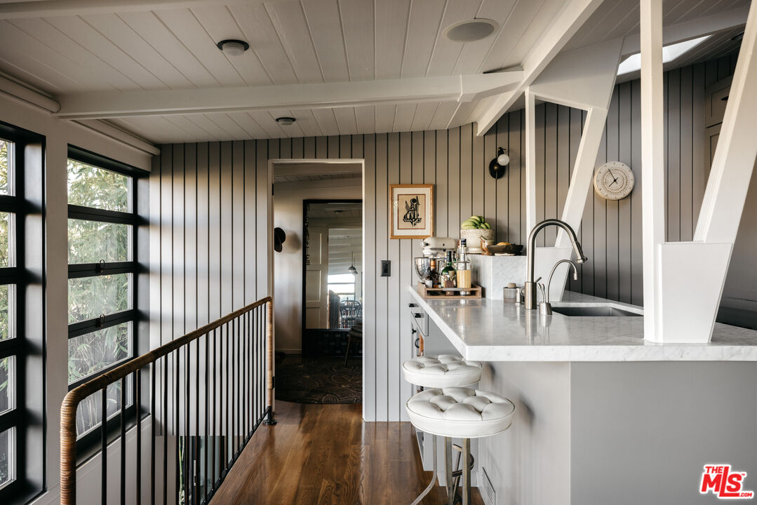 2044 Mayview Drive Los Angeles, CA 90027 - Photo 20 of 44 a view of a hallway with wooden floor and staircase
