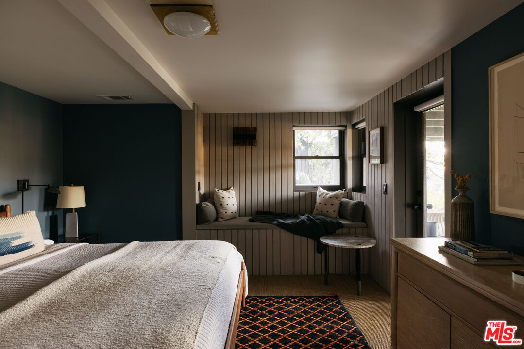 2044 Mayview Drive Los Angeles, CA 90027 - Photo 30 of 44 a bedroom with a bed and wooden floor