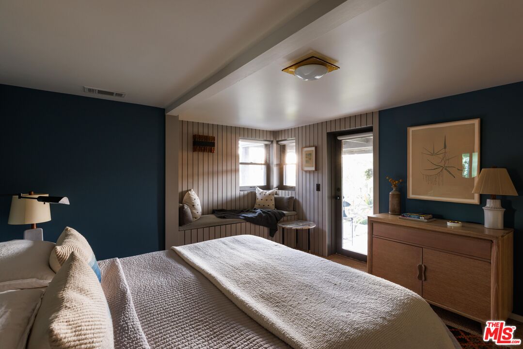 2044 Mayview Drive Los Angeles, CA 90027 - Photo 32 of 44 a bedroom with a bed and wooden floor