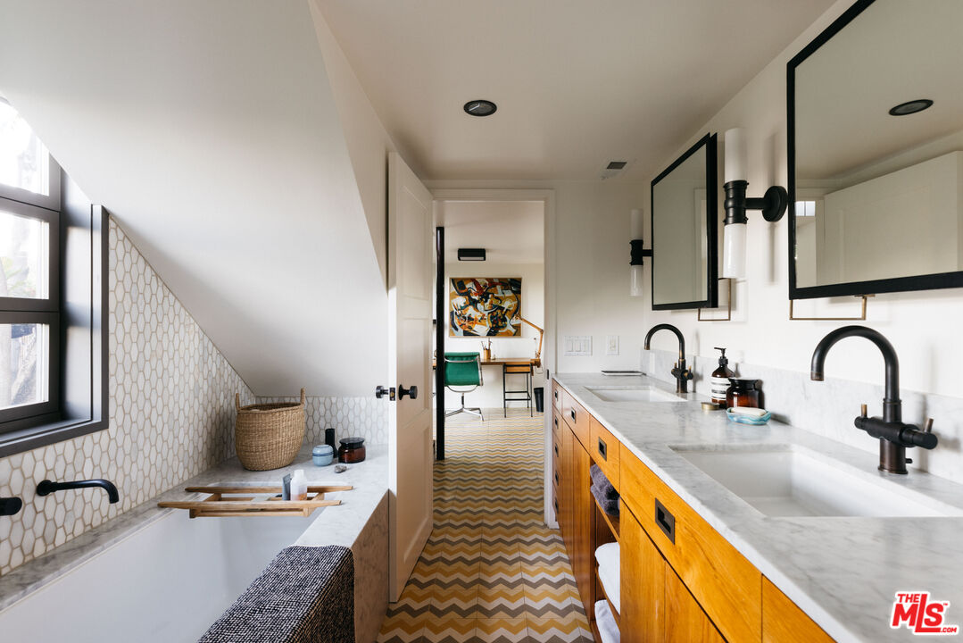 2044 Mayview Drive Los Angeles, CA 90027 - Photo 33 of 44 a kitchen with sink a counter and cabinets