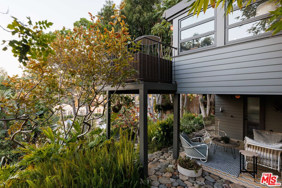 2044 Mayview Drive Los Angeles, CA 90027 - Photo 39 of 44 a view of a patio with table and chairs and potted plants