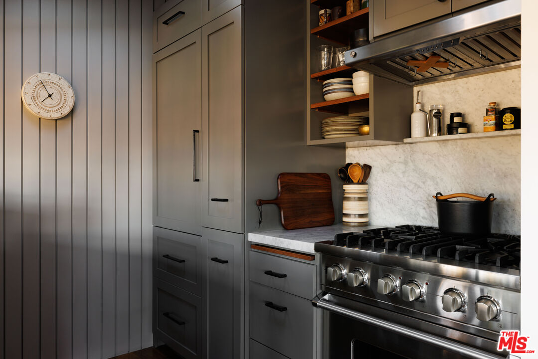 2044 Mayview Drive Los Angeles, CA 90027 - Photo 10 of 44 a kitchen with stainless steel appliances granite countertop a stove and a microwave