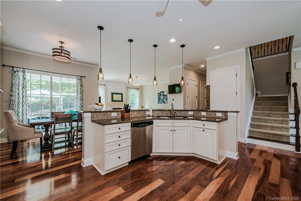651 Quicksilver Trail Fort Mill, SC 29708 - Photo 14 of 37 a kitchen with granite countertop a stove a sink and a refrigerator