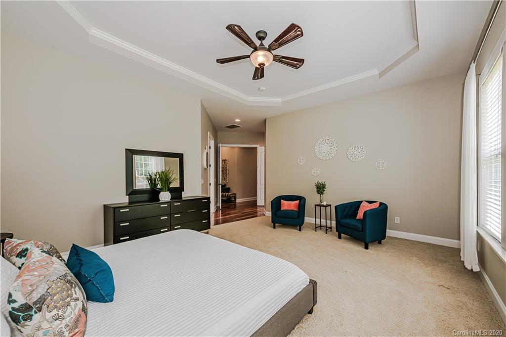 651 Quicksilver Trail Fort Mill, SC 29708 - Photo 17 of 37 a bedroom with a bed and a dresser
