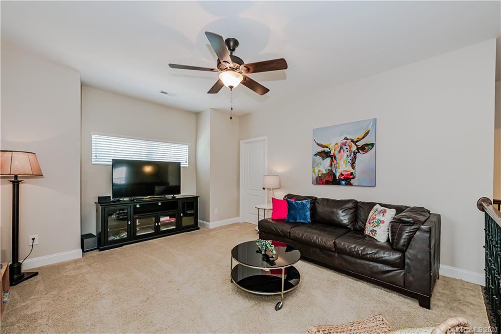 651 Quicksilver Trail Fort Mill, SC 29708 - Photo 22 of 37 a living room with furniture and a flat screen tv