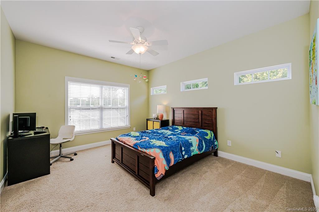 651 Quicksilver Trail Fort Mill, SC 29708 - Photo 23 of 37 a bedroom with a bed and a window