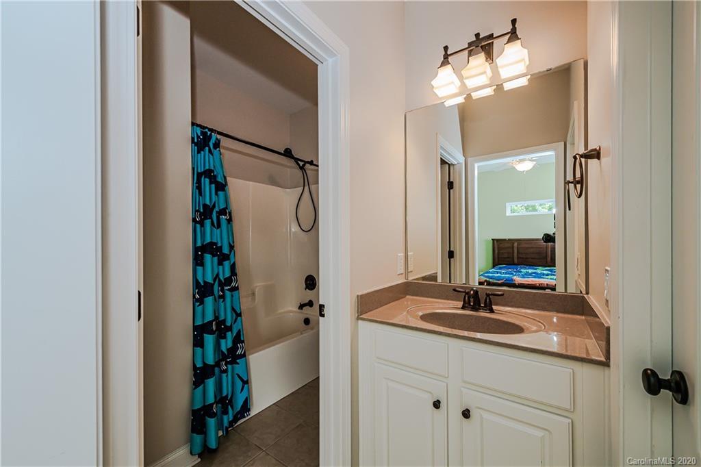 651 Quicksilver Trail Fort Mill, SC 29708 - Photo 24 of 37 a bathroom with a sink and a mirror