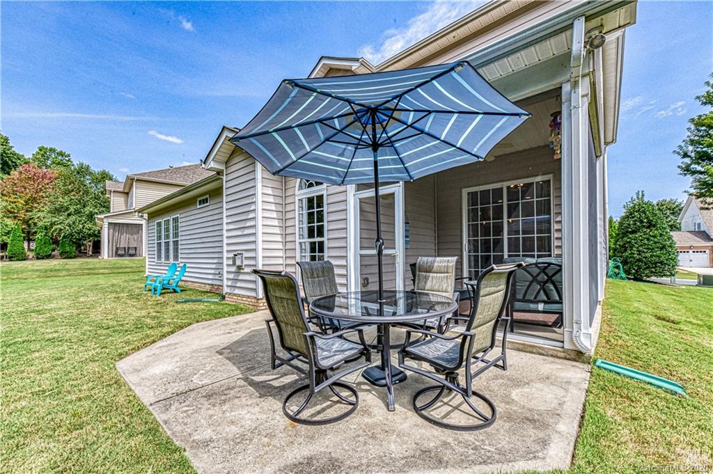 651 Quicksilver Trail Fort Mill, SC 29708 - Photo 31 of 37 a view of a chair and table in patio with wooden fence