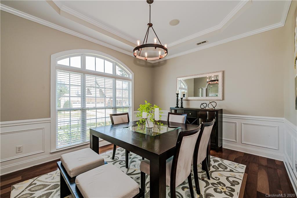 651 Quicksilver Trail Fort Mill, SC 29708 - Photo 5 of 37 a view of a dining room with furniture window and wooden floor