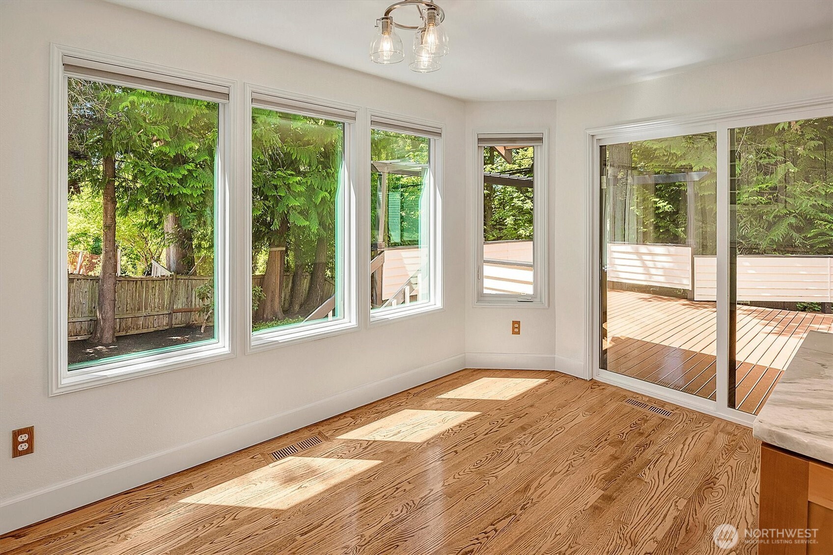 1918 238th Street Southeast Bothell, WA 98021 - Photo 14 of 36 a view of an empty room with wooden floor and a window