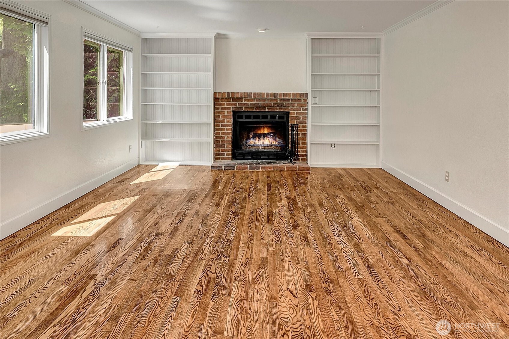 1918 238th Street Southeast Bothell, WA 98021 - Photo 15 of 36 a view of an empty room with wooden floor fireplace and a window