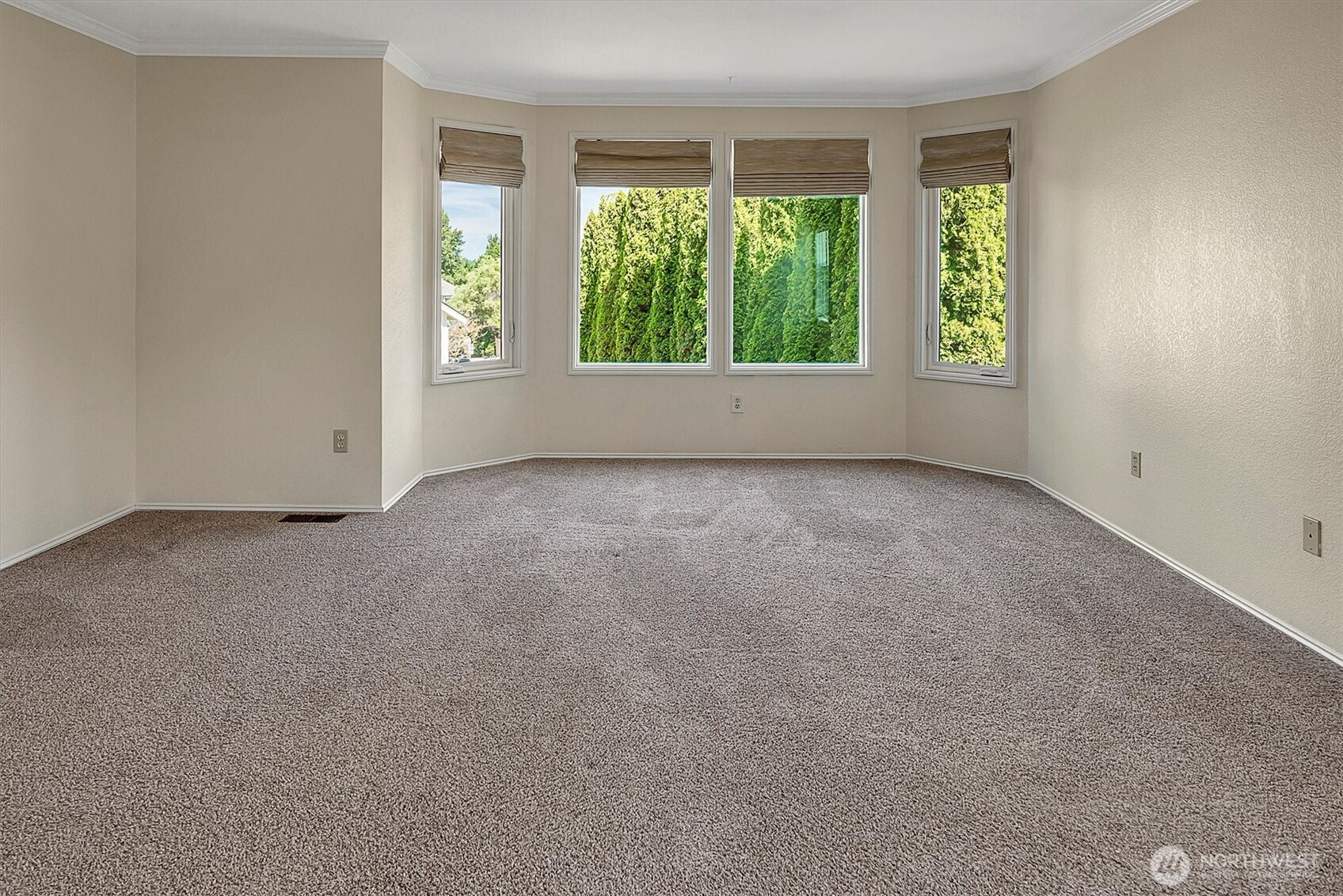 1918 238th Street Southeast Bothell, WA 98021 - Photo 21 of 36 an empty room with large windows and garden view