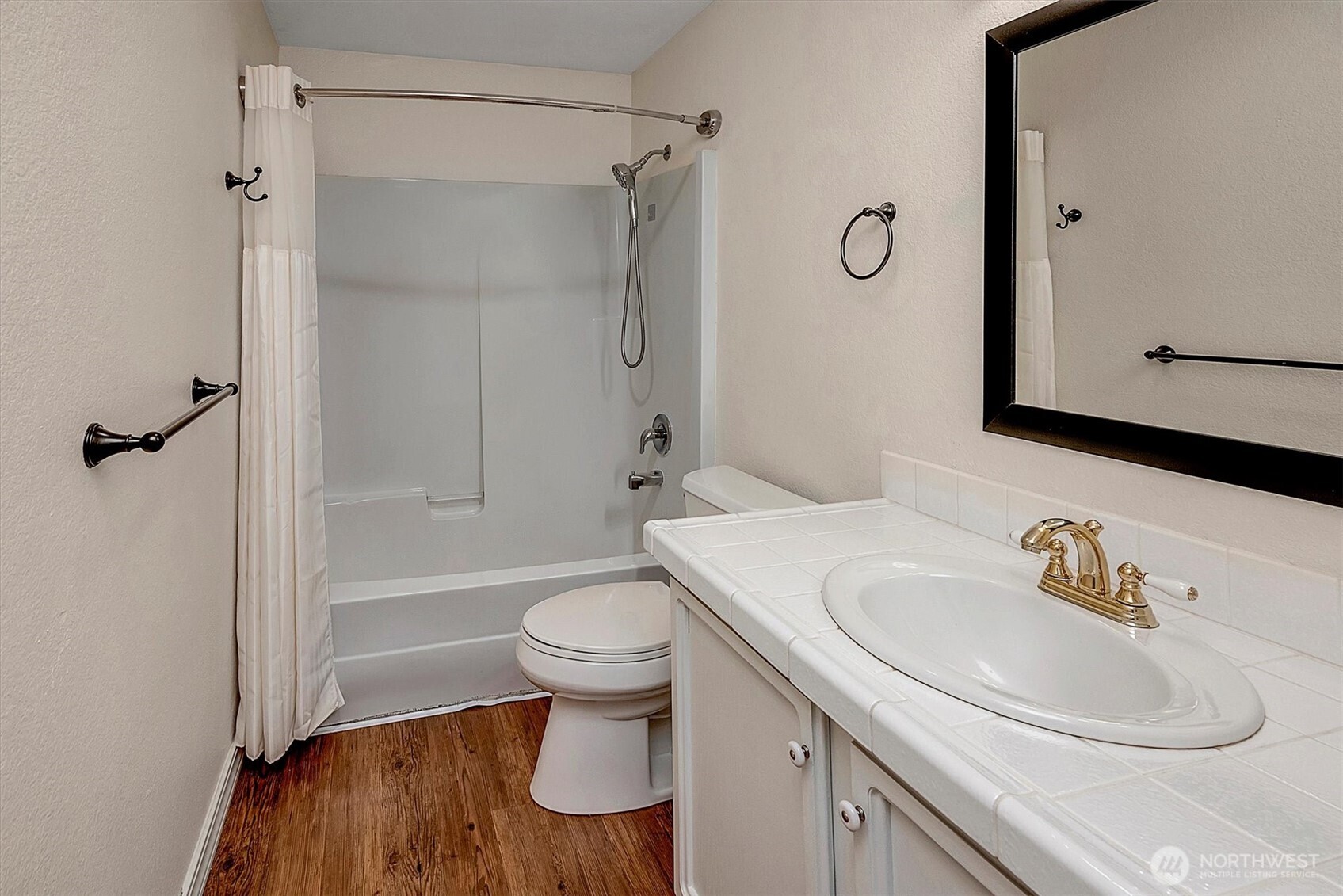 1918 238th Street Southeast Bothell, WA 98021 - Photo 28 of 36 a bathroom with a sink toilet and shower