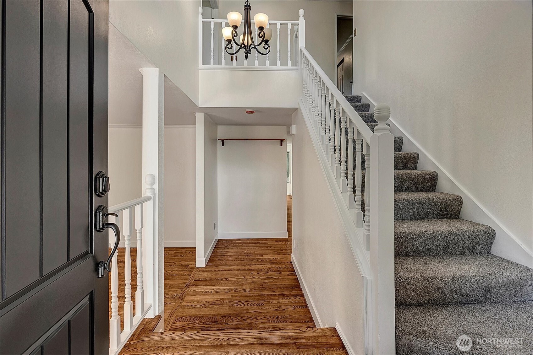 1918 238th Street Southeast Bothell, WA 98021 - Photo 3 of 36 a view of a hallway with wooden floor and entryway