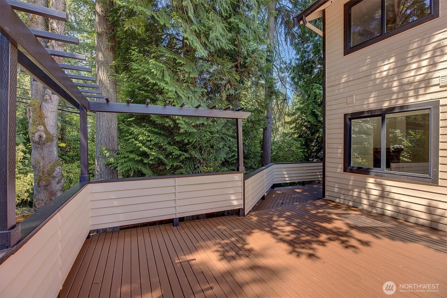 1918 238th Street Southeast Bothell, WA 98021 - Photo 34 of 36 a view of a roof deck with wooden floor and fence