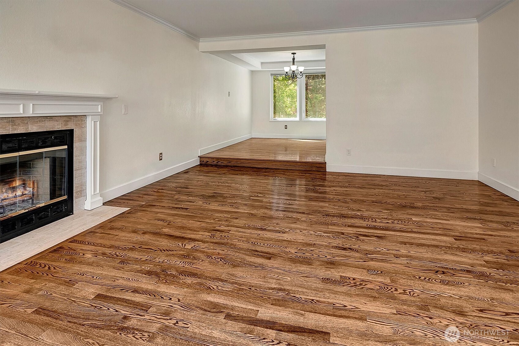 1918 238th Street Southeast Bothell, WA 98021 - Photo 6 of 36 a view of empty room with wooden floor and fireplace
