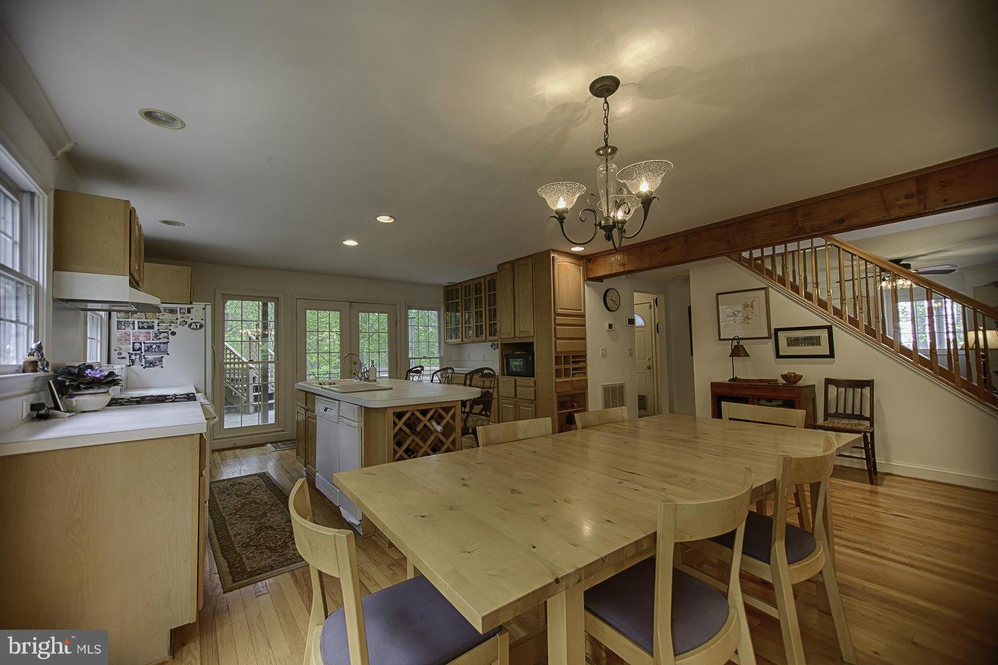 930 Pomeroy Road Front Royal, VA 22630 - Photo 11 of 30 a view of a dining room with furniture and a chandelier