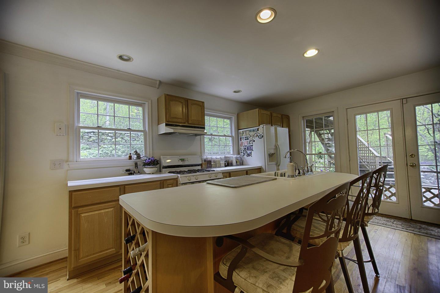 930 Pomeroy Road Front Royal, VA 22630 - Photo 12 of 30 a kitchen with appliances a sink and cabinets
