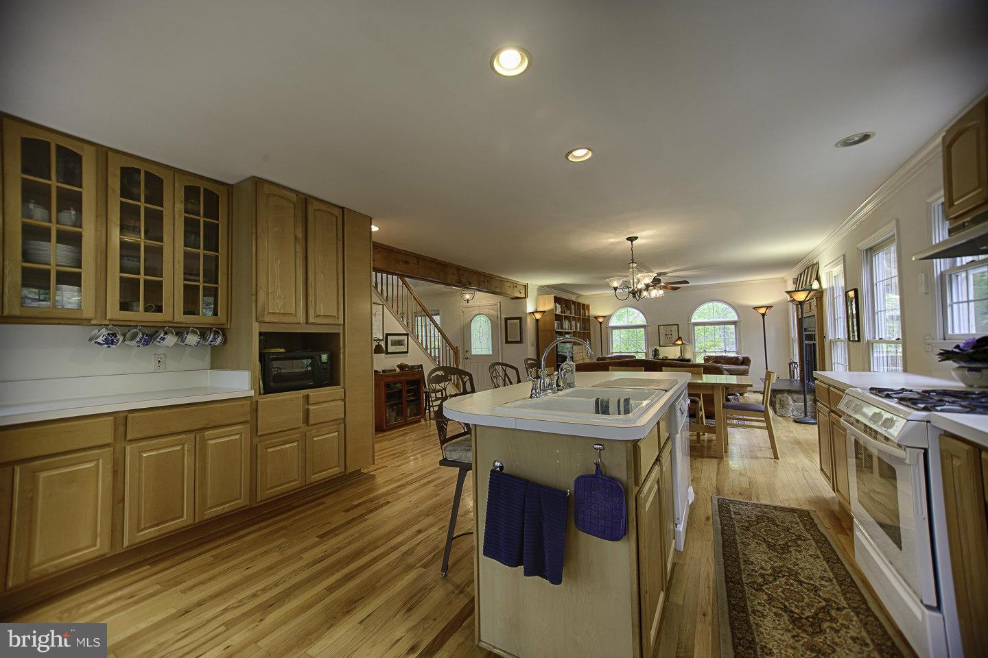 930 Pomeroy Road Front Royal, VA 22630 - Photo 13 of 30 a kitchen with stainless steel appliances granite countertop a sink stove and cabinets