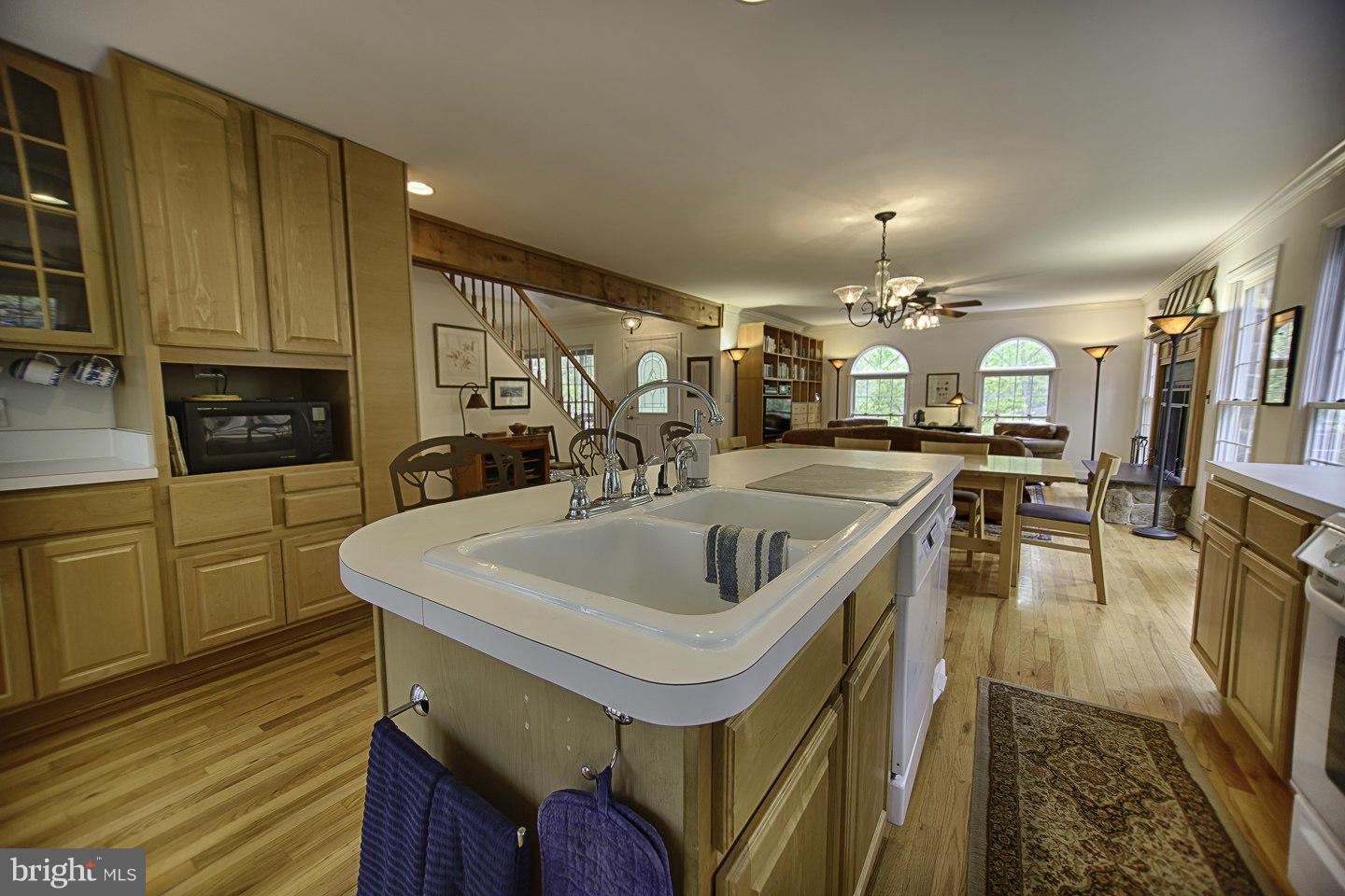 930 Pomeroy Road Front Royal, VA 22630 - Photo 14 of 30 a kitchen with stainless steel appliances granite countertop a sink a oven and a view of living room
