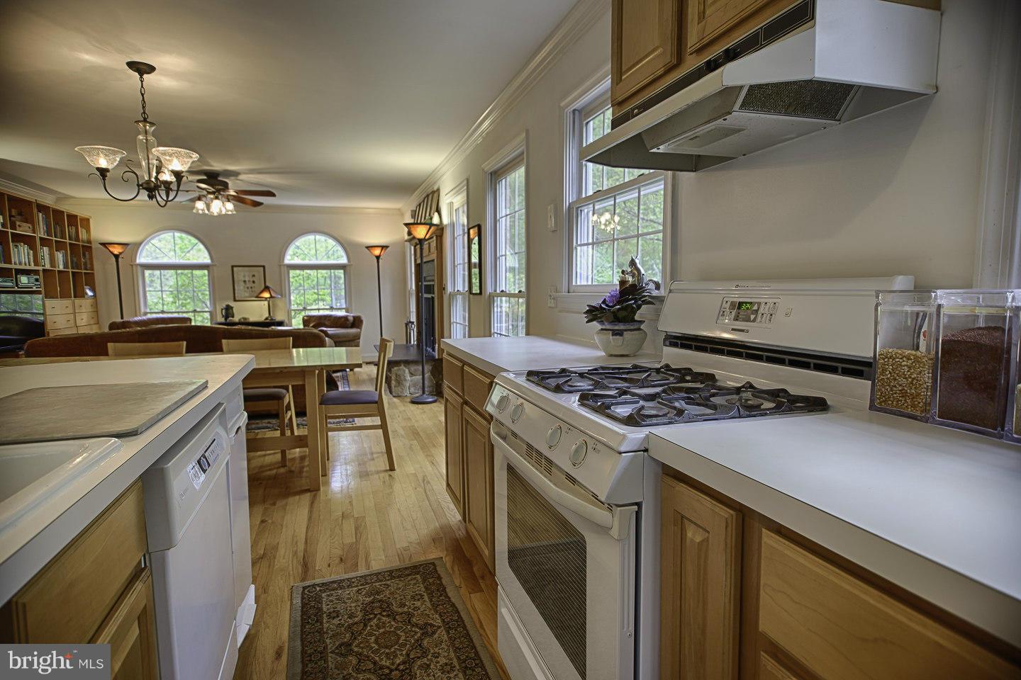930 Pomeroy Road Front Royal, VA 22630 - Photo 15 of 30 a kitchen with a stove and a chandelier