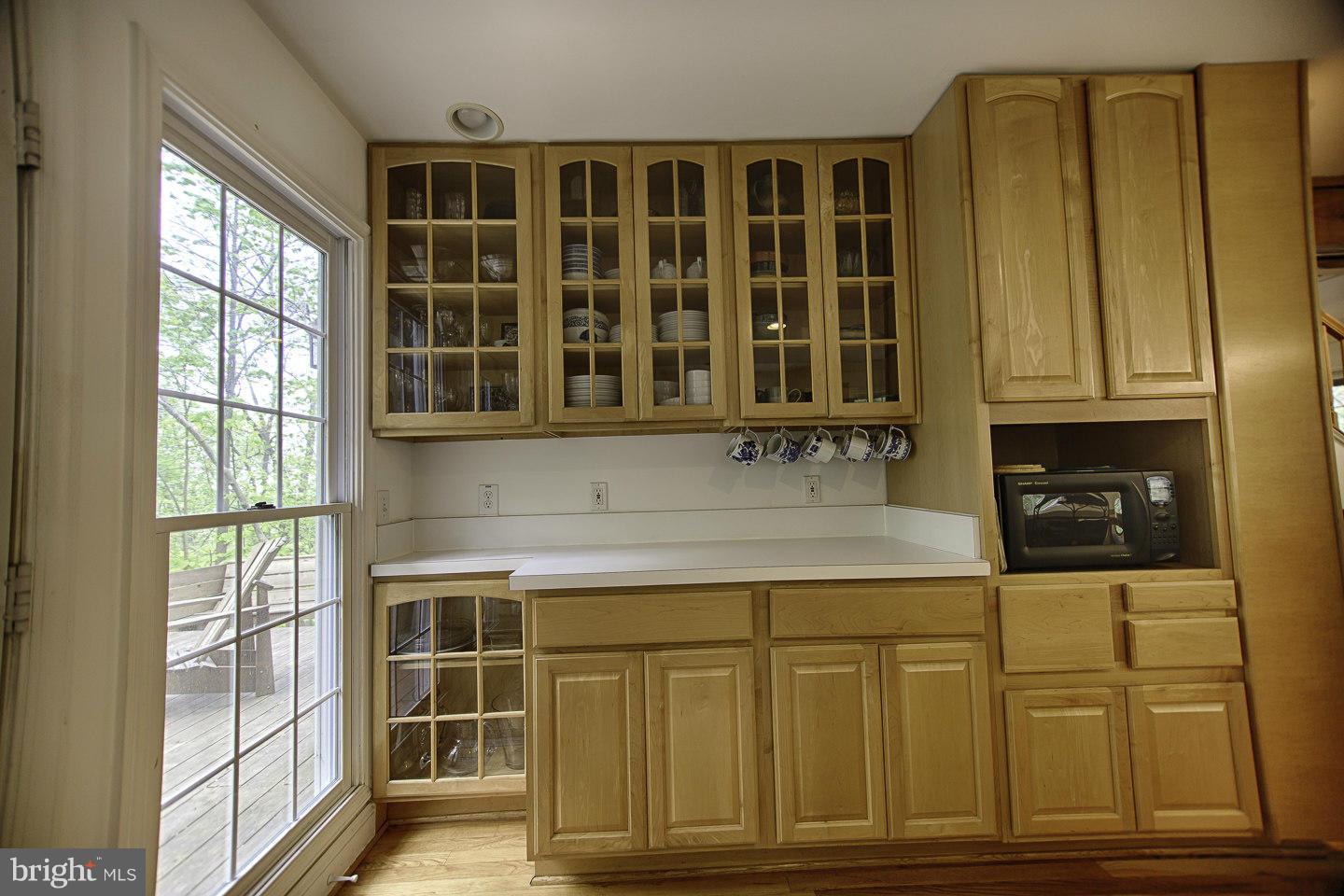 930 Pomeroy Road Front Royal, VA 22630 - Photo 16 of 30 a kitchen with stainless steel appliances granite countertop cabinets and window