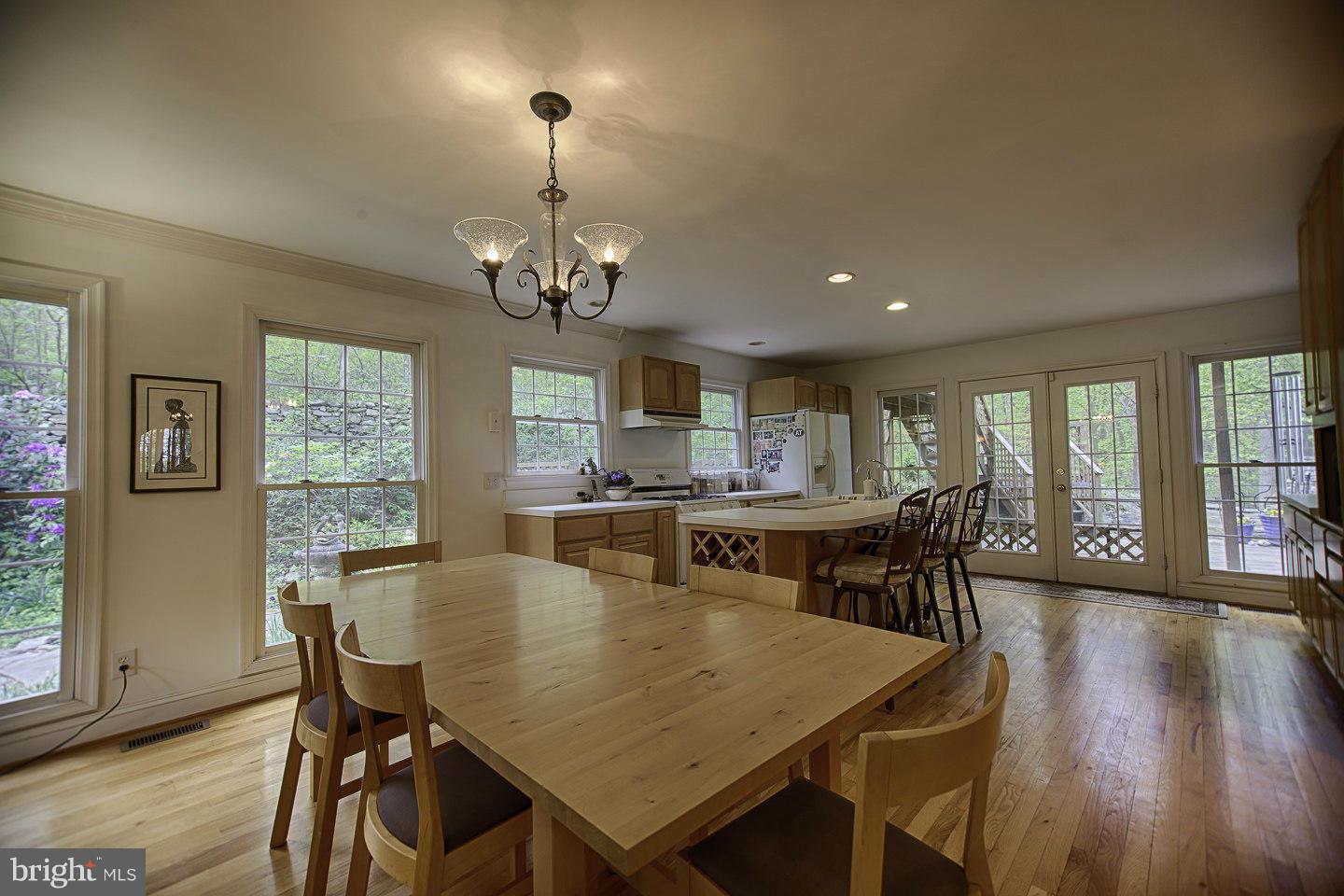 930 Pomeroy Road Front Royal, VA 22630 - Photo 10 of 30 a view of a dining room with furniture window and wooden floor