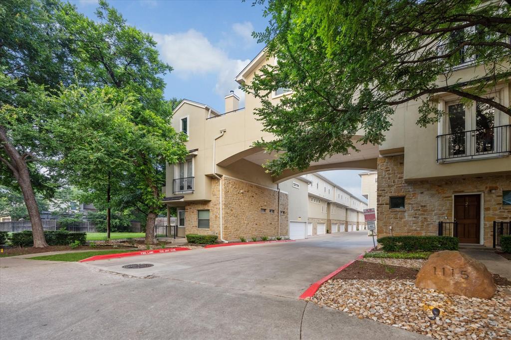 1115 Kinney Avenue, Unit 41 Austin, TX 78704 - Photo 1 of 26 a front view of a house with a yard and garage