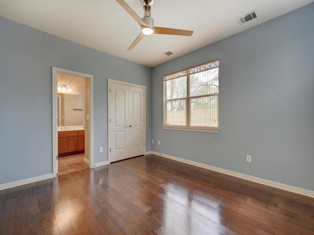 1115 Kinney Avenue, Unit 41 Austin, TX 78704 - Photo 13 of 26 a view of a livingroom with wooden floor and a window