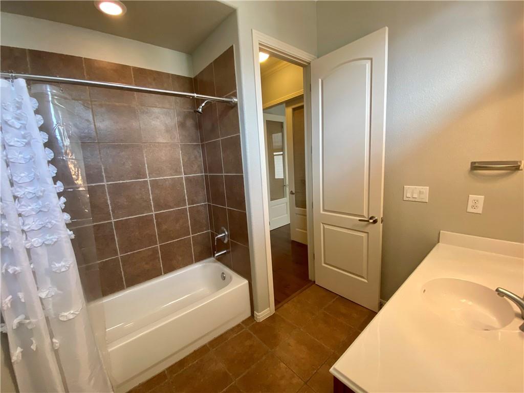 1115 Kinney Avenue, Unit 41 Austin, TX 78704 - Photo 16 of 26 a bathroom with a tub and shower