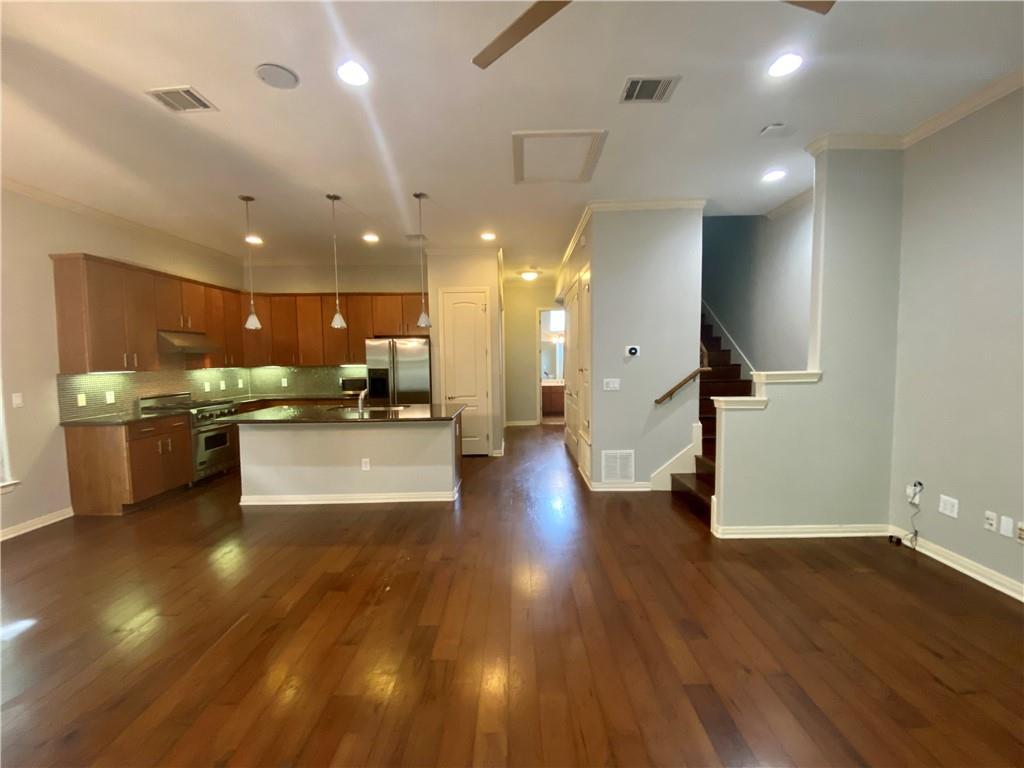 1115 Kinney Avenue, Unit 41 Austin, TX 78704 - Photo 7 of 26 a view of kitchen with cabinets and outdoor space