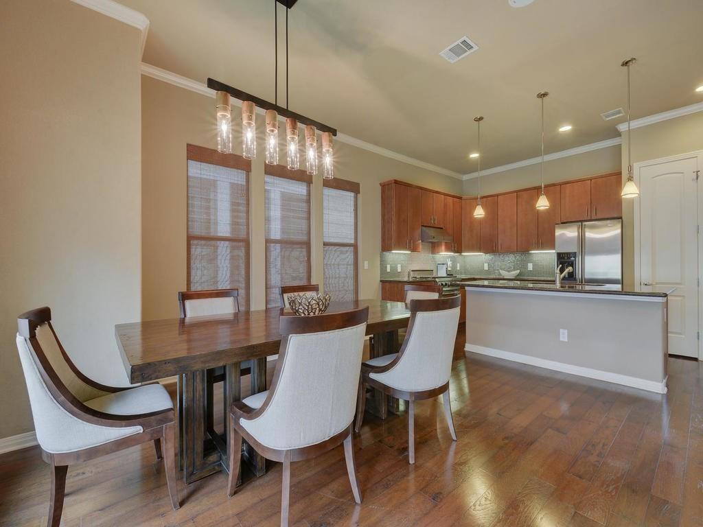 1115 Kinney Avenue, Unit 41 Austin, TX 78704 - Photo 10 of 26 a view of a dining room with furniture window and wooden floor