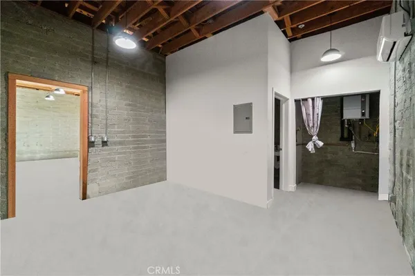 a view of a hallway with wooden shelves