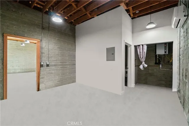 a view of a hallway with wooden shelves