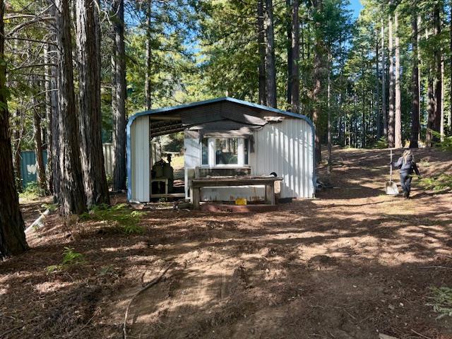 7175 Redwood Retreat Road Gilroy, CA 95020 - Photo 22 of 46 a front view of a house with a yard