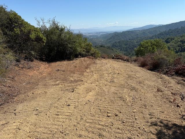 7175 Redwood Retreat Road Gilroy, CA 95020 - Photo 35 of 46 a view of a dry yard with mountains in the background