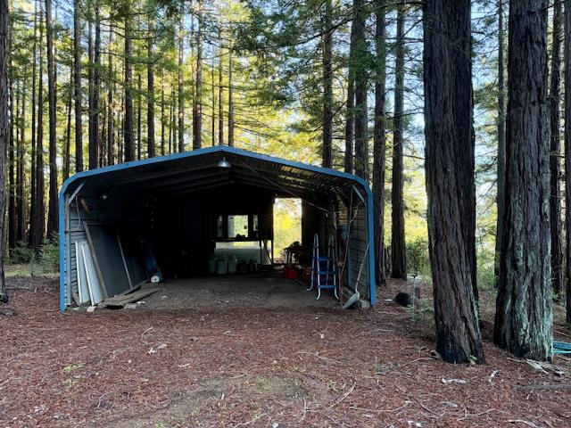 7175 Redwood Retreat Road Gilroy, CA 95020 - Photo 41 of 46 a view of a house with large trees and a barn