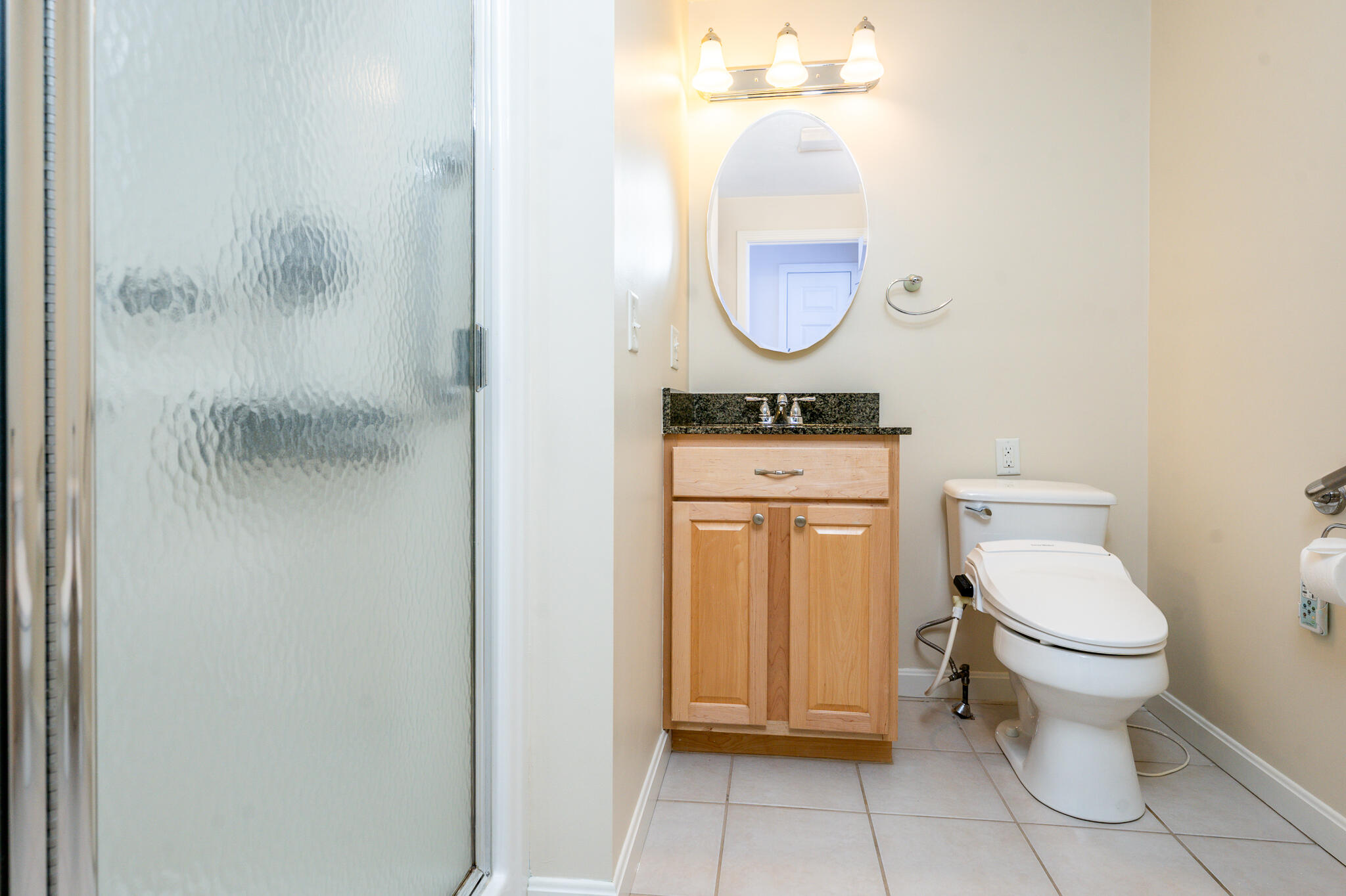 1 Masters Court Mashpee, MA 02649 - Photo 12 of 32 a bathroom with a toilet a sink and a mirror