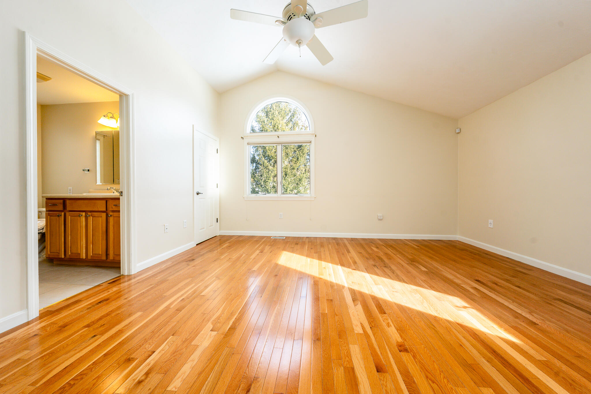 1 Masters Court Mashpee, MA 02649 - Photo 10 of 32 a view of empty room with wooden floor and fan