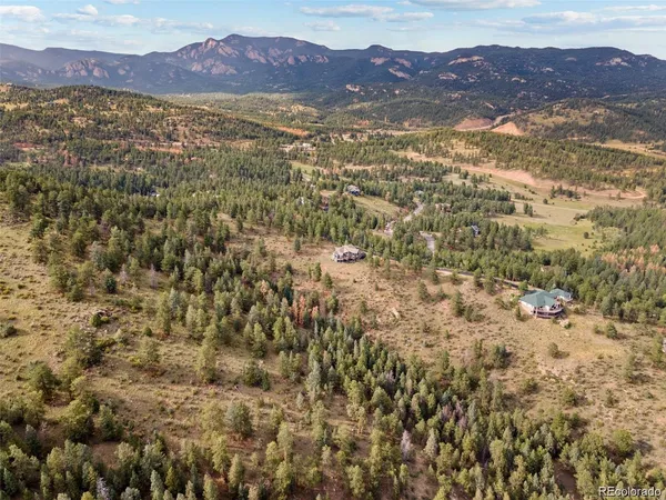 a view of an aerial view of residential house and mountain view