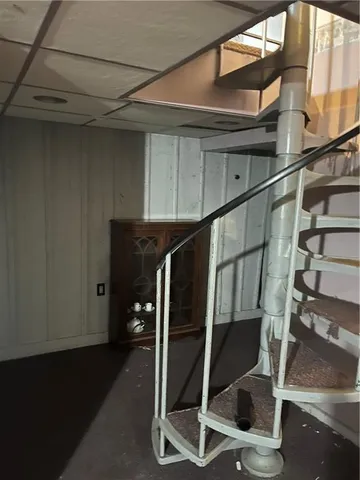 a view of empty room with fan and window