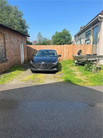 a view of backyard with swimming pool and outdoor seating