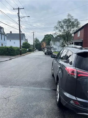 a view of a city street with cars