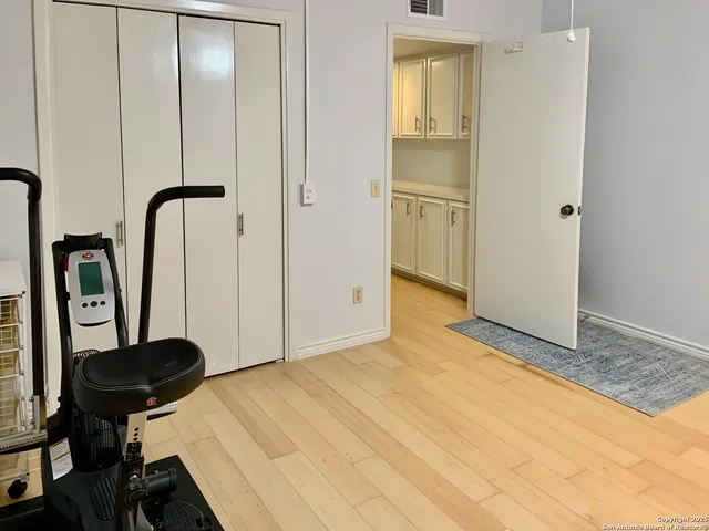 a living room with furniture and a lamp