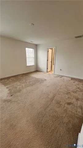 a spacious bathroom with a double vanity sink and mirror