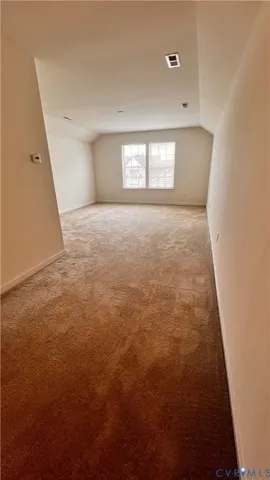 a bathroom with a granite countertop sink a toilet and a mirror