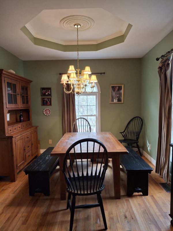 1525 Harkreader Road Mount Juliet, TN 37122 - Photo 6 of 20 a view of a dining room with furniture wooden floor and chandelier